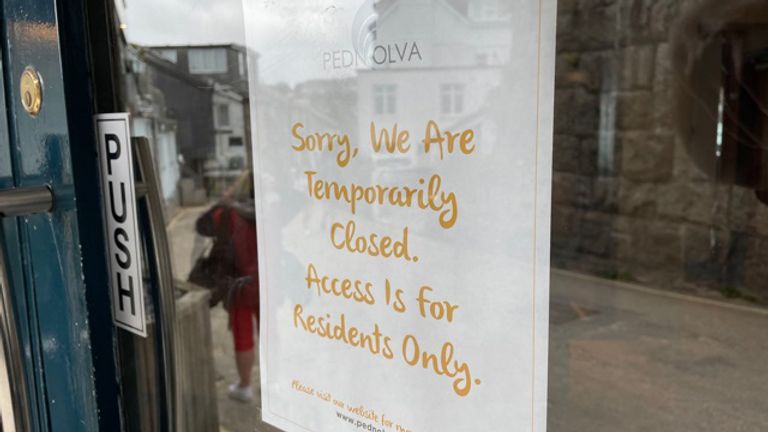 A sign on the door of the Pedn Olva hotel saying it has been closed