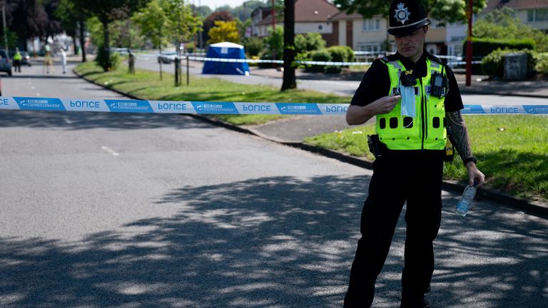 A police cordon is in place as officers hunt up to seven attackers