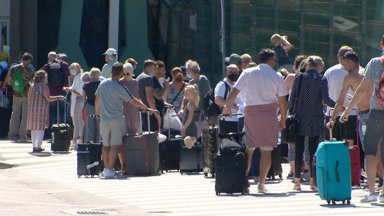 Tourists queuing at Faro airport