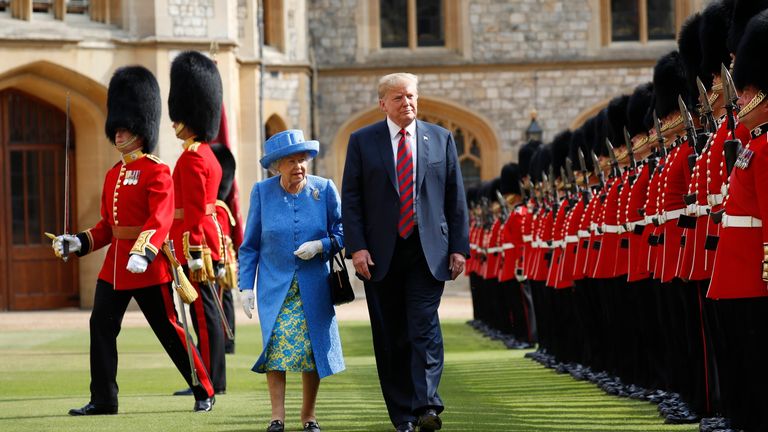 FILE - In this Friday, July 13, 2018 file photo, U.S. President Donald Trump and Britain&#39;s Queen Elizabeth inspects the Guard of Honour at Windsor Castle in Windsor, England. U.S. President Donald Trump will pay a state visit to Britain in June as a guest of Queen Elizabeth II, Buckingham Palace said Tuesday, April 23, 2019. The palace said Trump and his wife, Melania, had accepted an invitation from the queen for a visit that will take place June 3-5. (AP Photo/Pablo Martinez Monsivais, file)