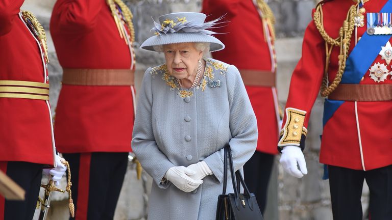 The Queen prepares to receive the salute during a ceremony at Windsor Castle to mark her official birthday