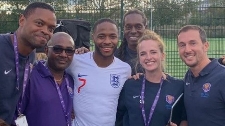 Raheem Sterling pictured with staff at Ark Elvin Academy, his former school. Pic: Paul Lawrence