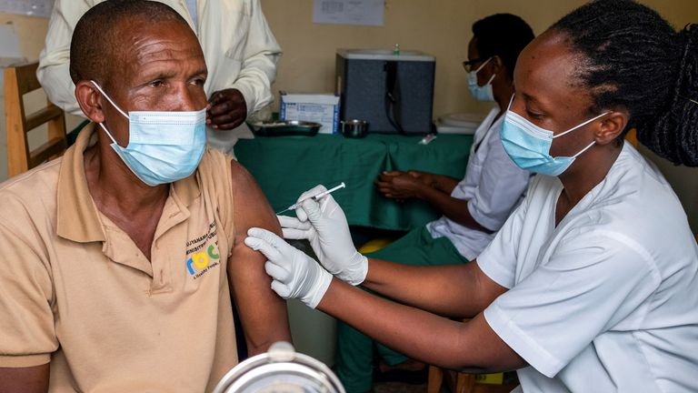 A man receives a vaccine against the coronavirus disease (COVID-19) at the Masaka hospital in Kigali, Rwanda March 5, 2021. REUTERS/Jean Bizimana/File Photo