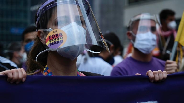 The protesters, unlike their president, believe masks can help slow the spread of the virus 