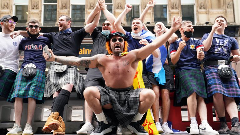 Scotland fans at Central station in Glasgow as they prepare to travel to London