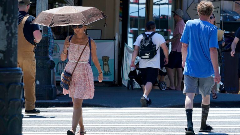 People shade from the heat in Seattle, Washington. Pic: AP