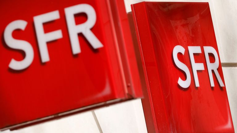 Logos of French telecoms operator SFR are pictured on a shop in Niort, France, March 4, 2021.