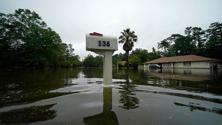 A flooded neighborhood is seen after Tropical Storm Claudette passed through in Slidell, La., Saturday, June 19, 2021. The National Hurricane Center declared Claudette organized enough to qualify as a named storm early Saturday, well after the storm&#39;s center of circulation had come ashore southwest of New Orleans. (AP Photo/Gerald Herbert)