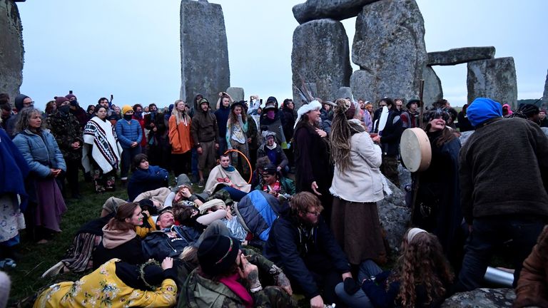 Revellers gather to celebrate the Summer Solstice at Stonehenge ancient stone circle
