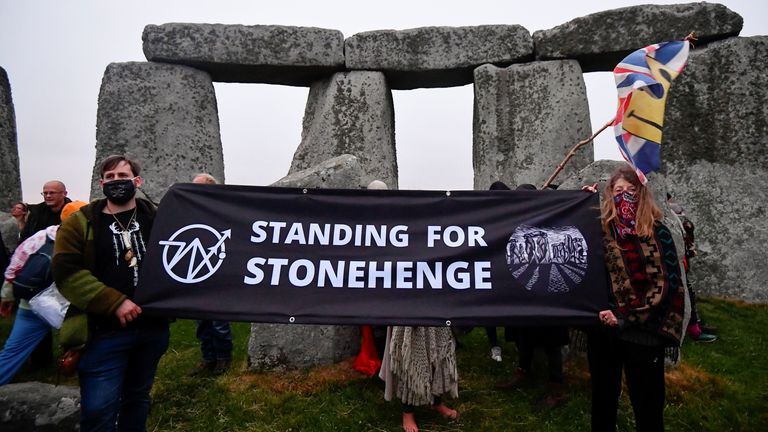People held up a banner saying &#39;Stand for Stonehenge&#39; at the monument