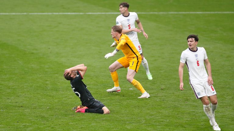 Thomas Mueller holds his head in his hands after missing a golden chance to equalise