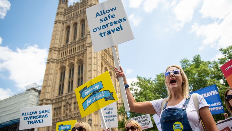 Protestors attend a demonstration by members of the travel industry on College Green, Westminster, central London, during a Travel Day of Action calling on the UK Government to support a safe return to international travel in time for the peak summer period. Picture date: Wednesday June 23, 2021.