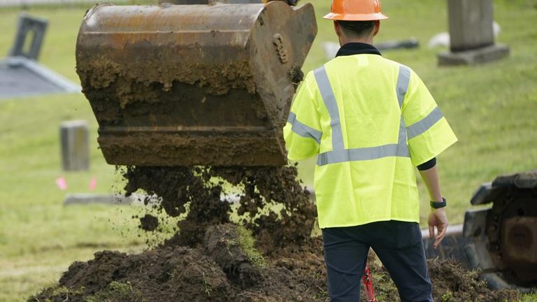 The victim search began last year and so far 20 coffins with remains have been found. Pic AP