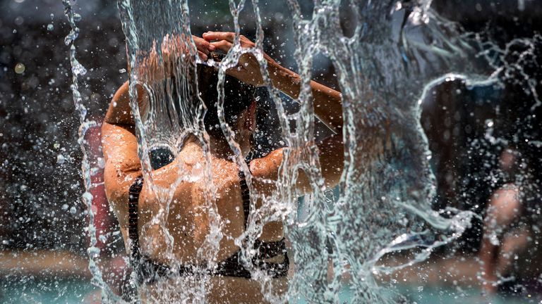 A woman cools off in a public pool during an unprecedented heat wave in Portland, Oregon, U.S. June 27, 2021. REUTERS/Maranie Staab