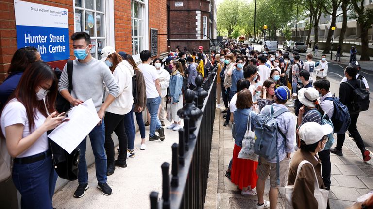 People queue outside a vaccination centre for young people and students at the Hunter Street Health Centre, amid the coronavirus disease (COVID-19) outbreak, in London, Britain, June 5, 2021