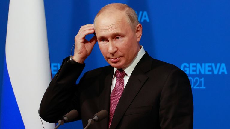 Vladimir Putin holds a news conference after the US-Russia summit