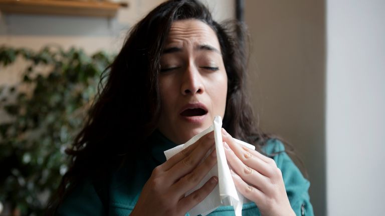 Woman pictured about the sneeze. Pc: istock