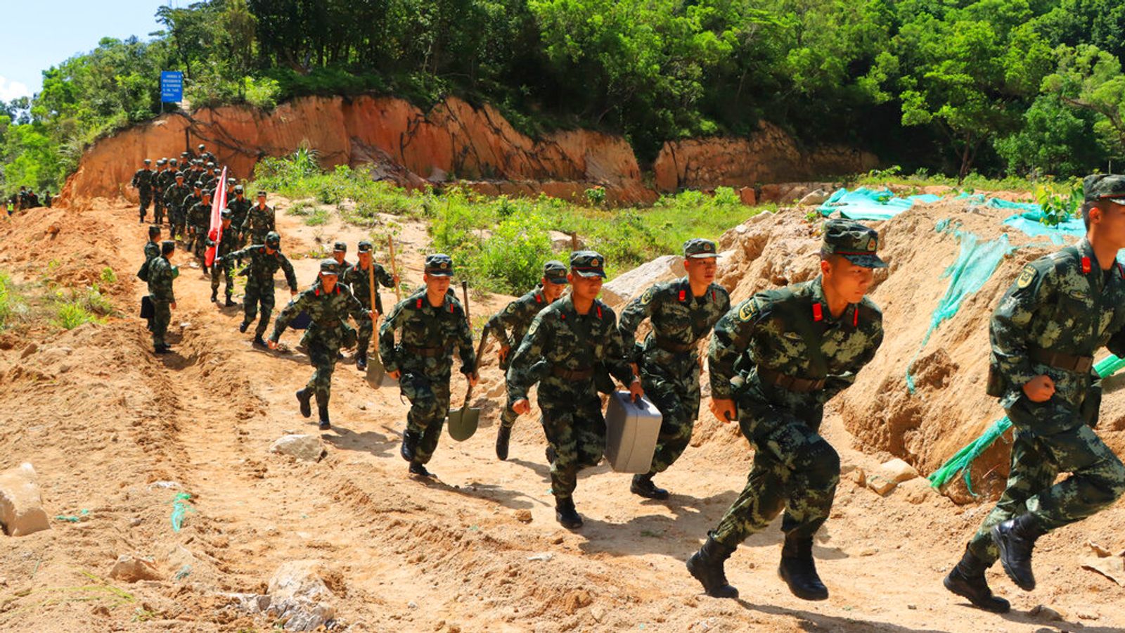 China: Huge search launched to find 14 construction workers trapped as ...