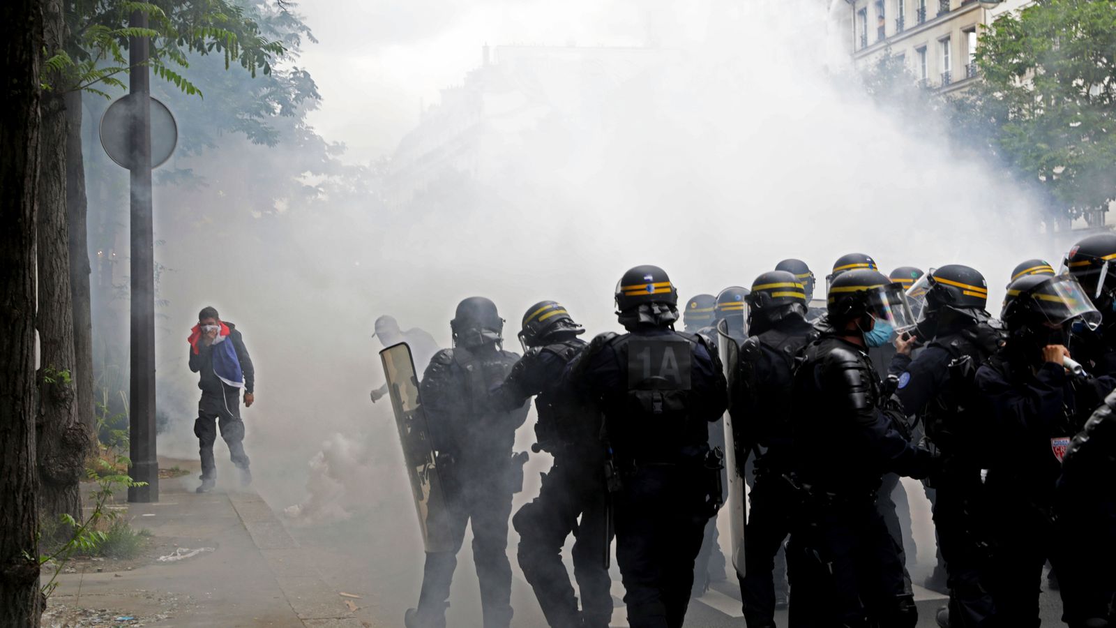 COVID-19: Tear gas fired amid clashes at coronavirus vaccine passport protests in Paris