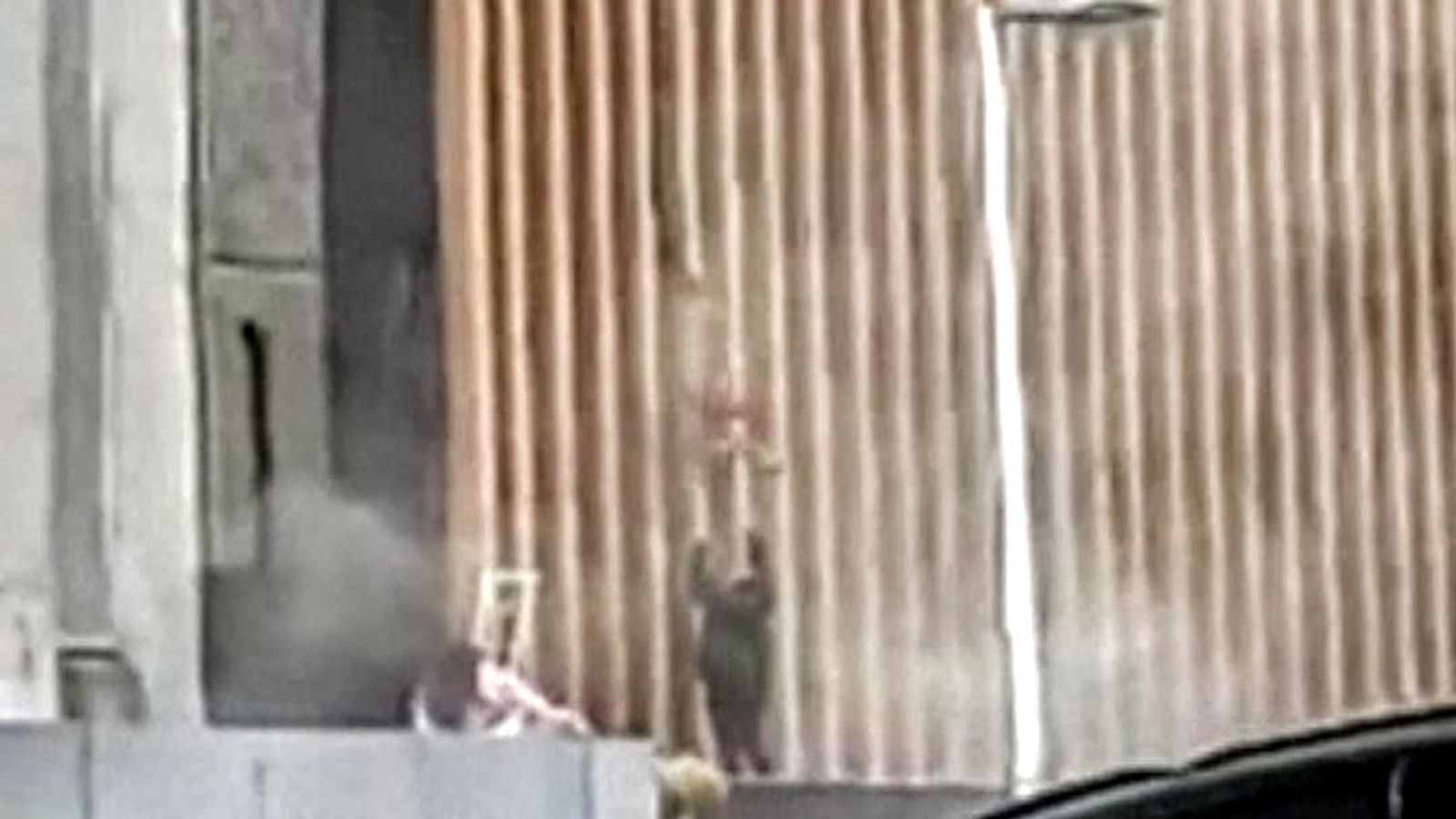 South Africa violence Mother throws baby to safety from burning building World News Sky News