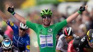 Mark Cavendish celebrates wining his fourth stage of this year's Tour de France, equalling Eddy Merckx's record of 34 overall