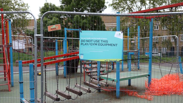 Activity equipment in the children's playground area of a park in London is closed off, as the UK continues in lockdown to help curb the spread of the coronavirus.