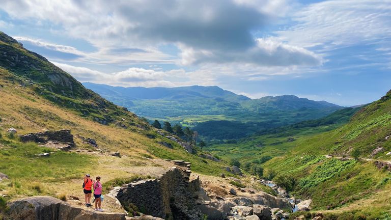 People enjoy the warm weather and sunshine on the Watkin Path on Mount Snowdon in Gwynedd, Wales. Picture date: Saturday July 24, 2021.