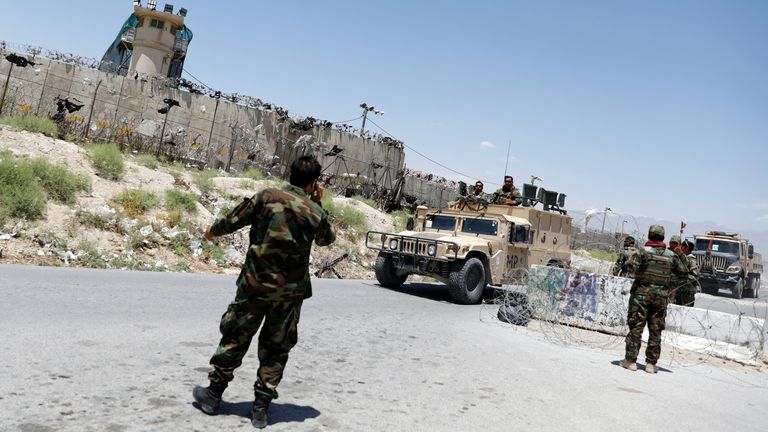 Afghan soldiers stand guard at a checkpoint outside the U.S Bagram air base, on the day the last of American troops vacated it, Parwan province, Afghanistan July 2, 2021.REUTERS/Mohammad Ismail