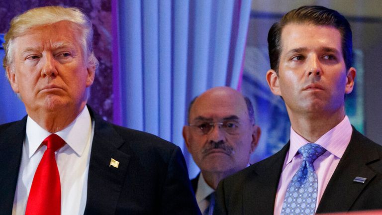 Allen Weisselberg is pictured (centre) with Donald Trump (left) and his son (right). Pic: AP
