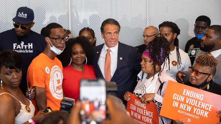 New York Governor Andrew Cuomo poses to take a picture with supporters after making an announcement that Gun Manufacturers are Liable for the harm their products cause, in New York City, New York, U.S., July 6, 2021. REUTERS/Jeenah Moon