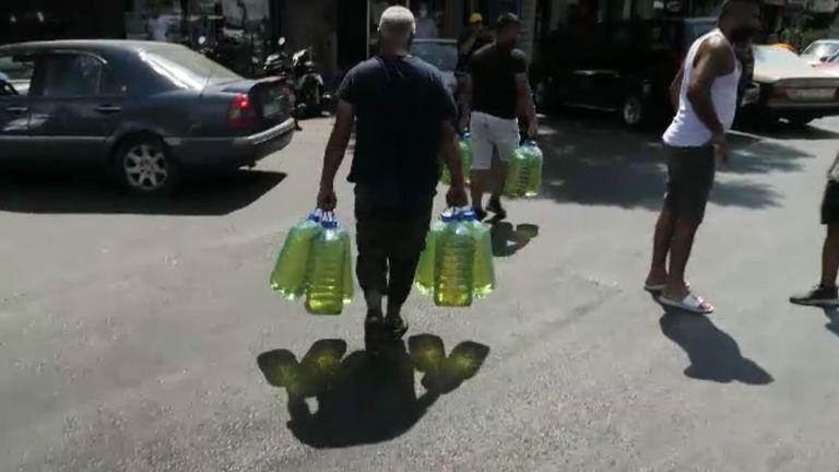 A man gathers supplies amid shortages in Beirut