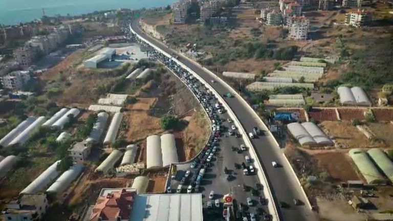 Queues of cars waiting for fuel stretch for miles