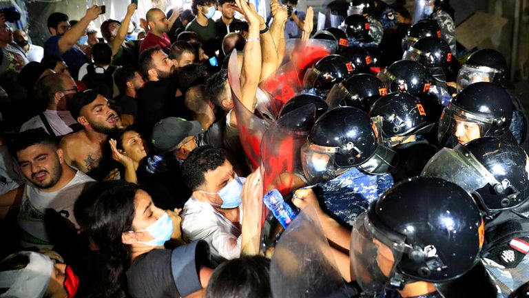 Protesters clash with police at demonstration in memory of relatives lost in Beirut blast. Pic: AP