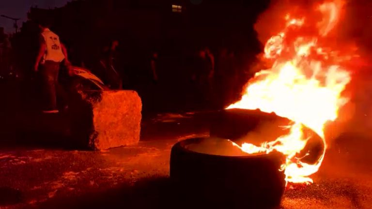 Tyres burn on the streets of Beirut during regular protests amid the crisis