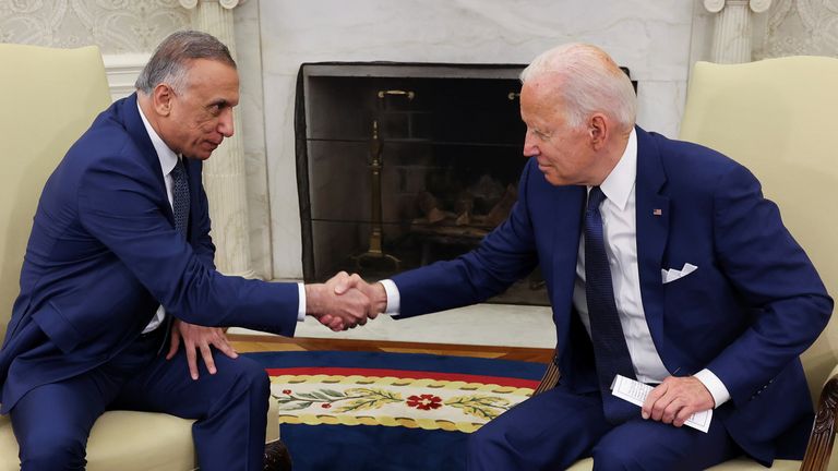 U.S. President Joe Biden greets Iraq&#39;s Prime Minister Mustafa Al-Kadhimi during a bilateral meeting in the Oval Office at the White House in Washington, U.S., July 26, 2021. REUTERS/Evelyn Hockstein