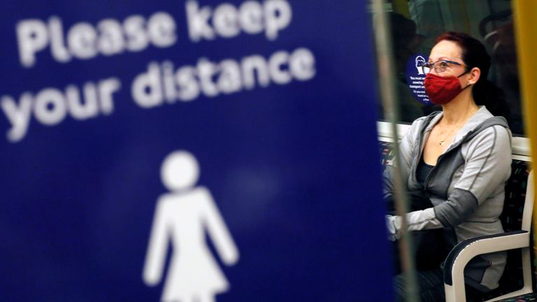 A woman wears a face mask while riding on subway in London, United Kingdom on June 23, 2021, amid a pandemic of the new coronavirus COVID-19.  ( The Yomiuri Shimbun via AP Images )