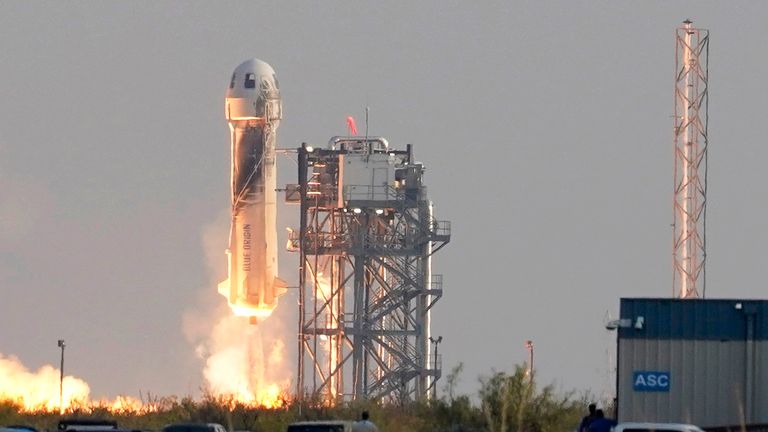 Blue Origin&#39;s New Shepard rocket launches carrying passengers Jeff Bezos, founder of Amazon and space tourism company Blue Origin, brother Mark Bezos, Oliver Daemen and Wally Funk, from its spaceport near Van Horn, Texas, Tuesday, July 20, 2021. (AP Photo/Tony Gutierrez)