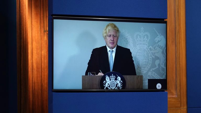 Boris Johnson leads a virtual Downing Street briefing from isolation.