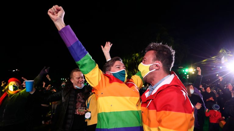 People celebrate in Brisbane after the city was picked to host the 2032 Olympics