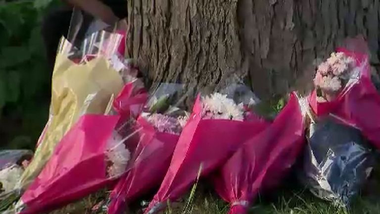 Flowers left by a tree on Southborough Lane