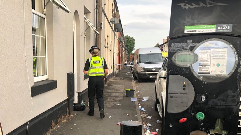 Police at the scene on East Street in Bury where a 31-year-old woman suffered severe burns and later died