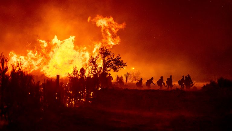 Firefighters battle part of the Beckwourth Complex Fire, in Doyle, California. Pic: AP