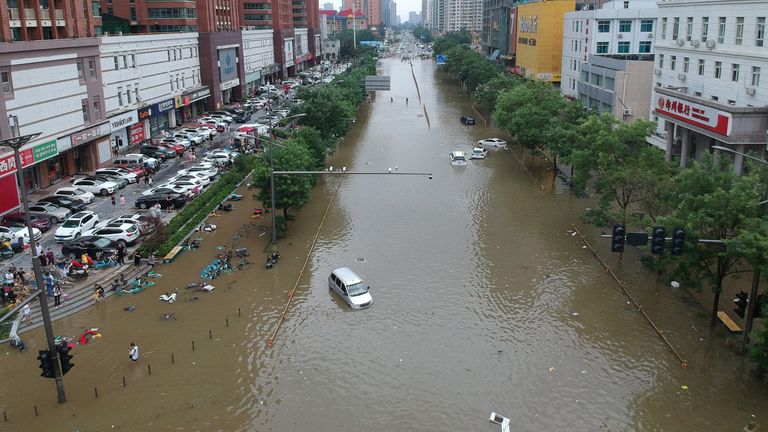 An aerial view shows a flooded road section following heavy rainfall in Zhengzhou, Henan province, China July 21, 2021. Picture taken with a drone. China Daily via REUTERS ATTENTION EDITORS - THIS IMAGE WAS PROVIDED BY A THIRD PARTY. CHINA OUT.