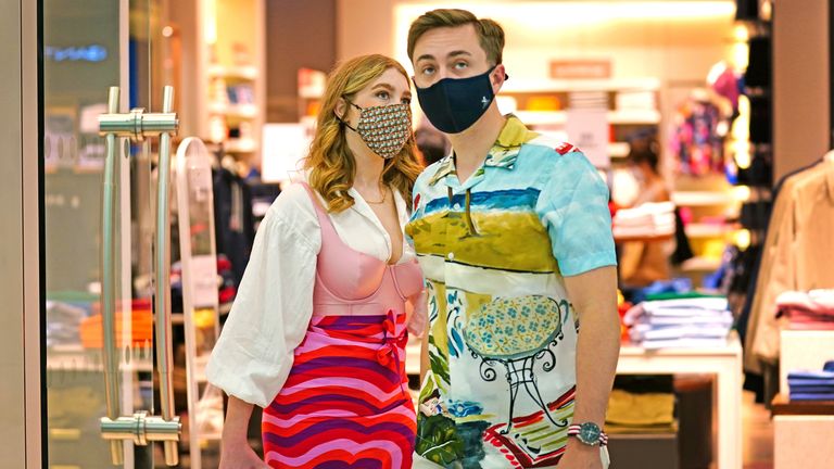 Two shoppers wearing facemasks inside a shopping centre in East London