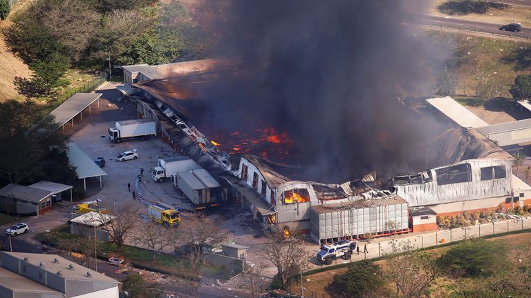 A burning warehouse after violence erupted following the jailing of former South African President Jacob Zuma, in Durban, South Africa, July 14, 2021