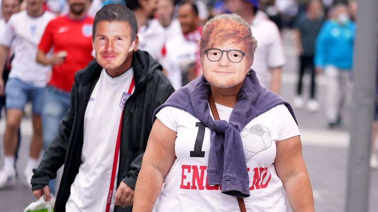 England fans sporting facemasks of Ed Sheeran and David Beckham outside Wembley