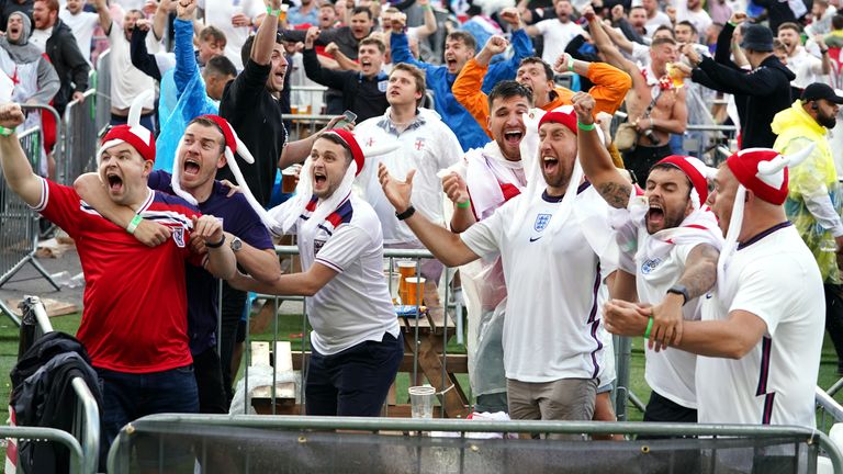 ngland fans in Manchester celebrate as Harry Kane scores his side&#39;s first goal, during the Euro 2020 quarter final match between England and Ukraine. Picture date: Saturday July 3, 2021.