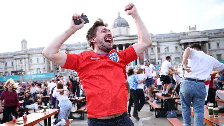 Soccer Football - Euro 2020 - Fans gather in London ahead of Ukraine v England - London, Britain - July 3, 2021 England fans in Trafalgar Square celebrate scoring their first goal REUTERS/Henry Nicholls