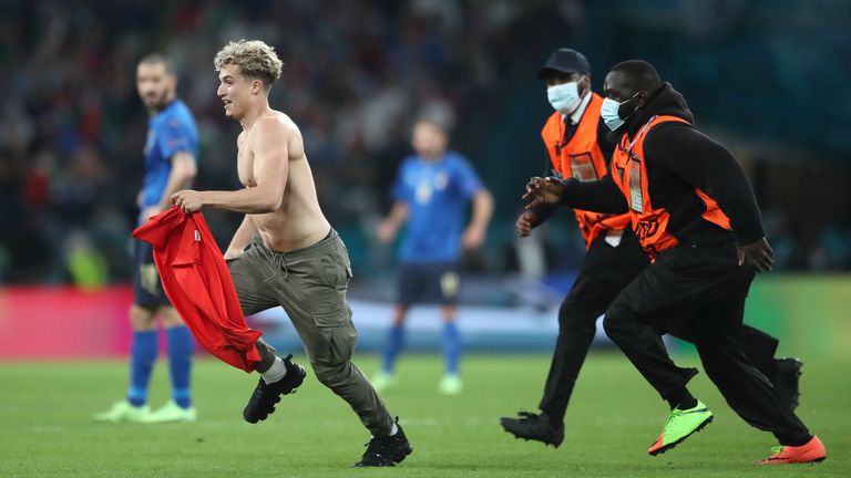 A pitch invader was chased off the field by four stewards near just before full-time