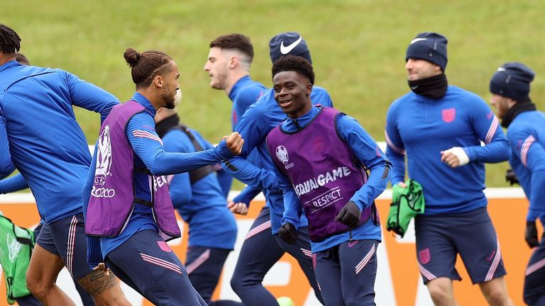 England&#39;s Bukayo Saka and Dominic Calvert-Lewin with teammates during training